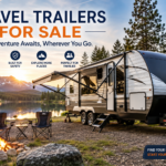Travel trailers for sale at a scenic lakeside campsite