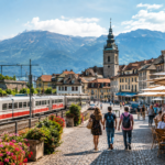 European travel scene with a historic Alpine town, scenic train, cafés, travelers, lake, and mountains